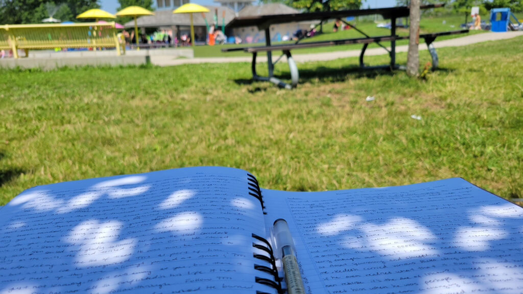 writing at the splash pad while my daughter splashed around 